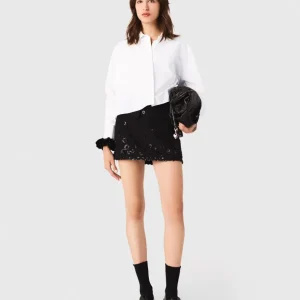 Pantalón corto trampantojo bordado